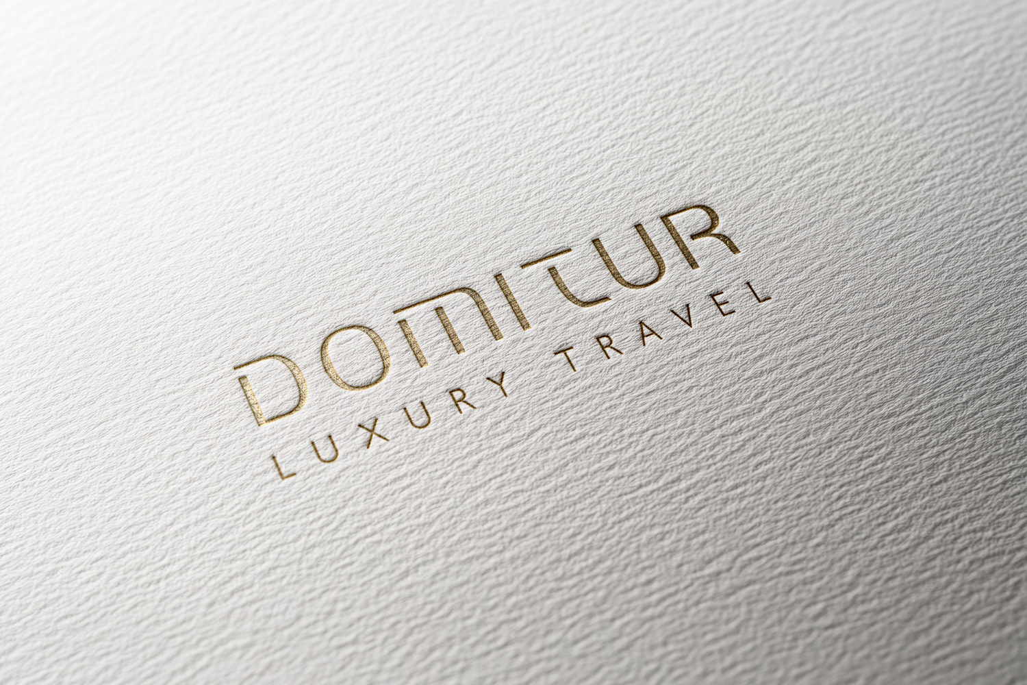 Domitur embossed logo detail